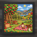 A framed square art print depicting a colorful pixel-art style autumn landscape with an apple tree, picnic blanket, basket, sun, and distant hills. The artwork is shown in a black frame against a dark wood background.