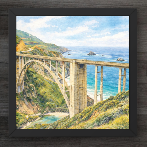 Framed artwork of a scenic bridge over a body of water with mountains in the background.