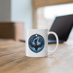 White mug with a blue and black design on a wooden surface