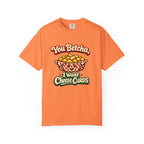 An orange short-sleeve crewneck t-shirt featuring a cartoon graphic of a basket of cheese curds with the text 'You Betcha, I Want Cheese Curds' in stylized lettering.