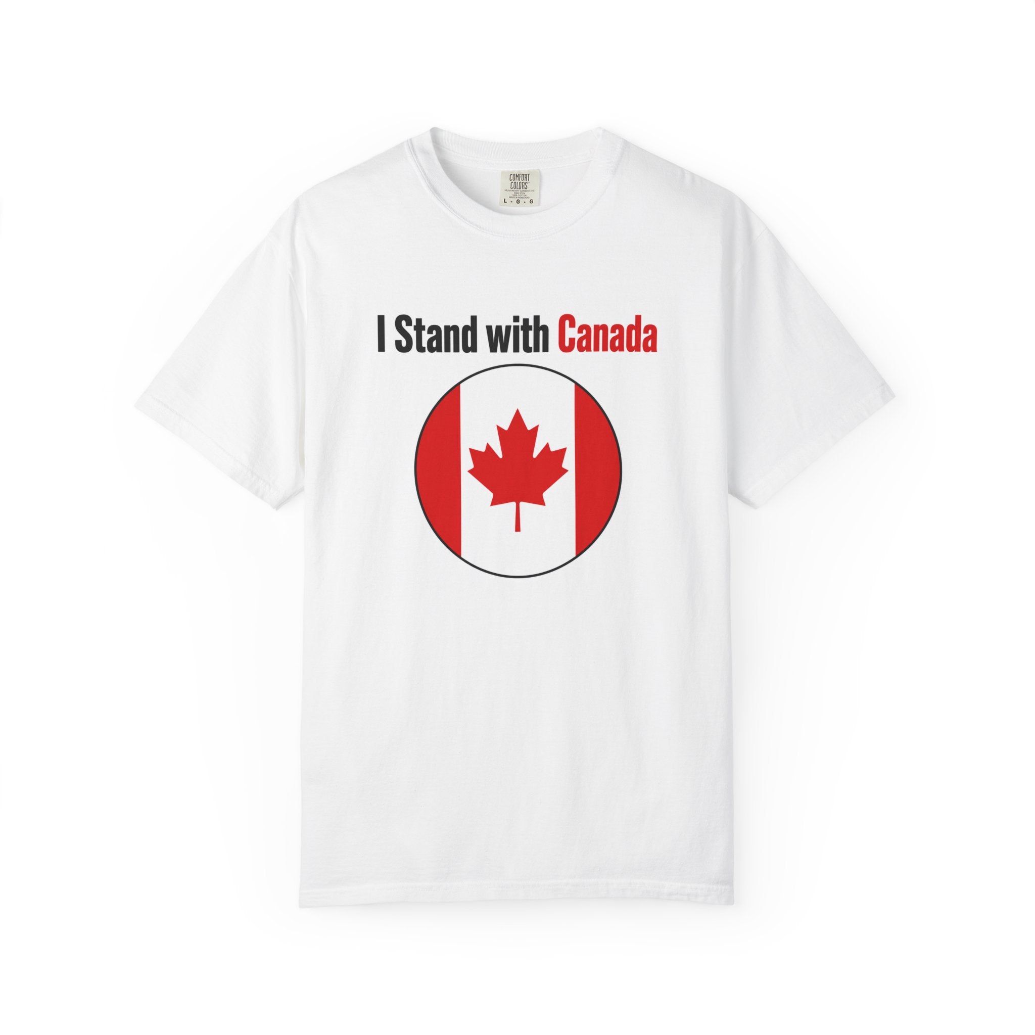 A white short-sleeve crewneck t-shirt featuring the text 'I Stand with Canada' in black and red above a circular Canadian flag graphic on the chest.