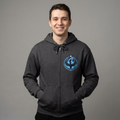 Man wearing a dark gray hoodie with a logo on a gray background