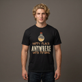 A man wearing a black graphic t-shirt with a potion bottle and the text 'HAPPY PLACE: ANYWHERE WITH POTIONS' printed on the front, set against a solid dark gray background.