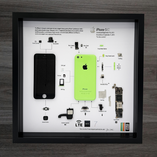 Framed display of an iPhone 5C with exploded view and Apple logo.