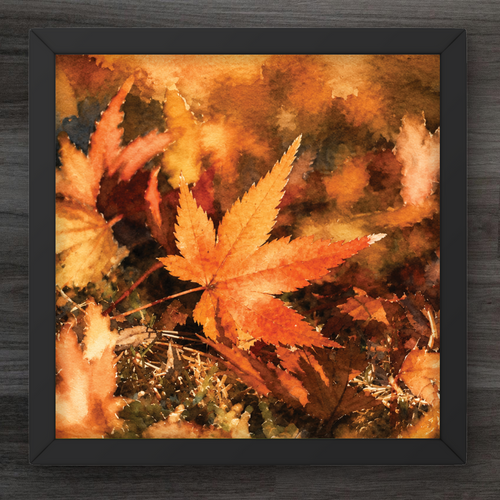 A square framed art print featuring a watercolor painting of autumn maple leaves in warm shades of orange, yellow, and brown, set against a dark wood background.