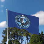 A Rebel Loon Flag waving in the wind on a flagpole with trees and sky in the background