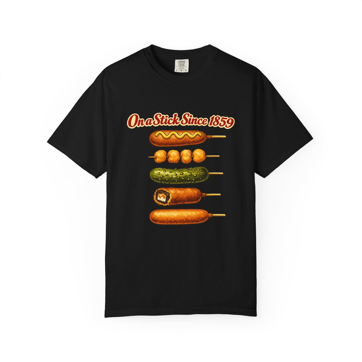 A black short-sleeve t-shirt with a graphic print of various corn dogs on sticks and the text 'On a Stick Since 1859' in red and yellow, displayed against a plain white background.