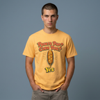 A man wearing a yellow graphic t-shirt with the text 'PRONTO PUP? CORN DOG?' and 'Yes' in front of a corn dog illustration, standing against a solid gray background.