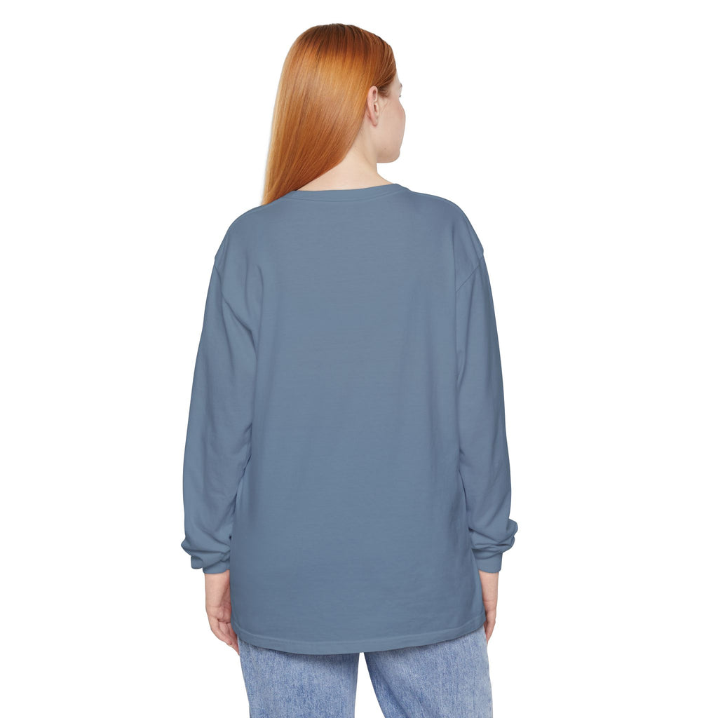 Person wearing a blue long-sleeve shirt on a white background