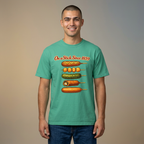 A man wearing a mint green graphic t-shirt with a corn dog progression print and blue jeans, standing against a neutral beige background.