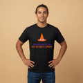 A man wearing a black t-shirt with a graphic of an orange witch hat and the text 'WITCH BETTER HAVE MY CANDY' in purple and orange, posed against a solid beige background.
