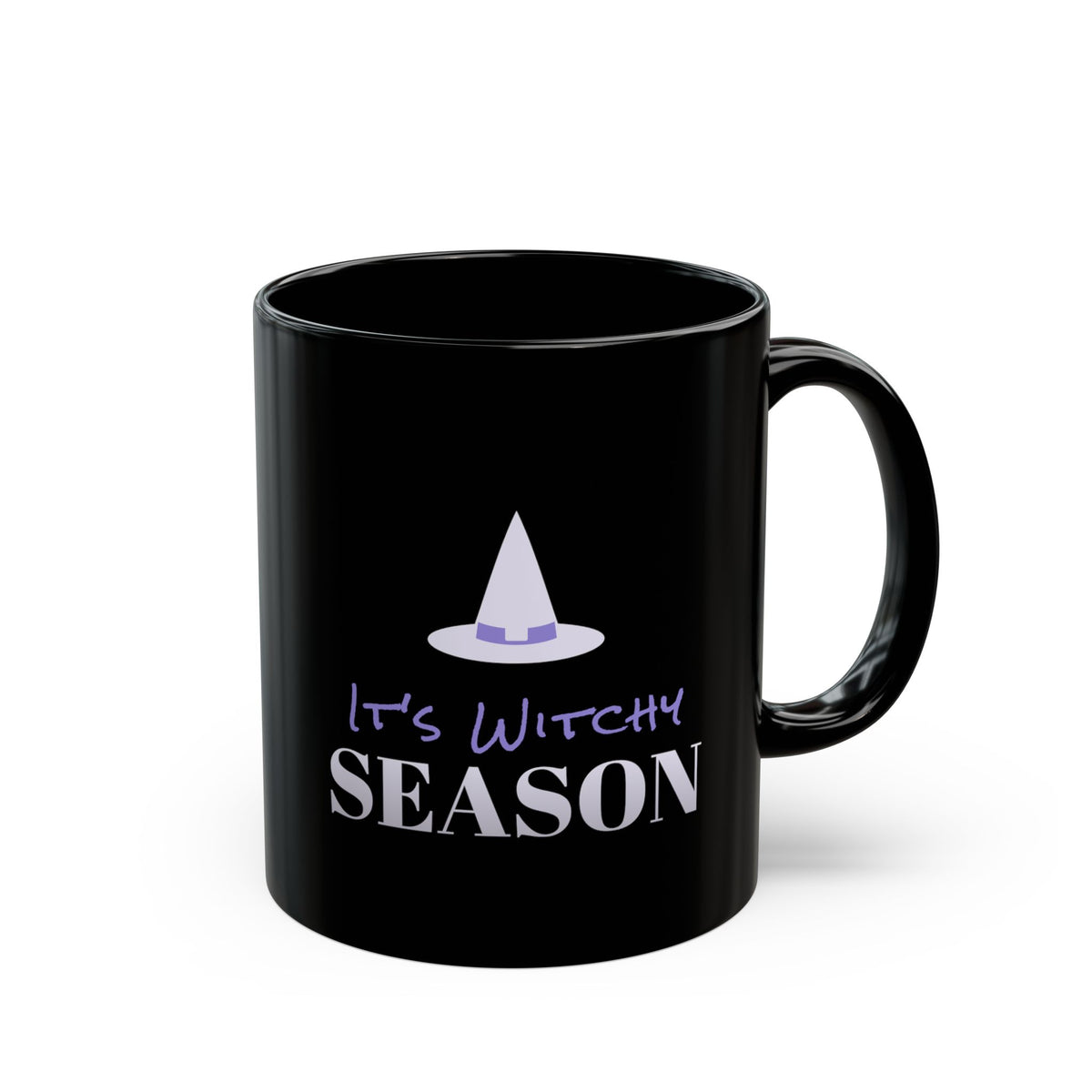 A black ceramic mug with a glossy finish, featuring a graphic design of a purple witch hat and the text 'It's Witchy SEASON' in purple and white, set against a plain white background.
